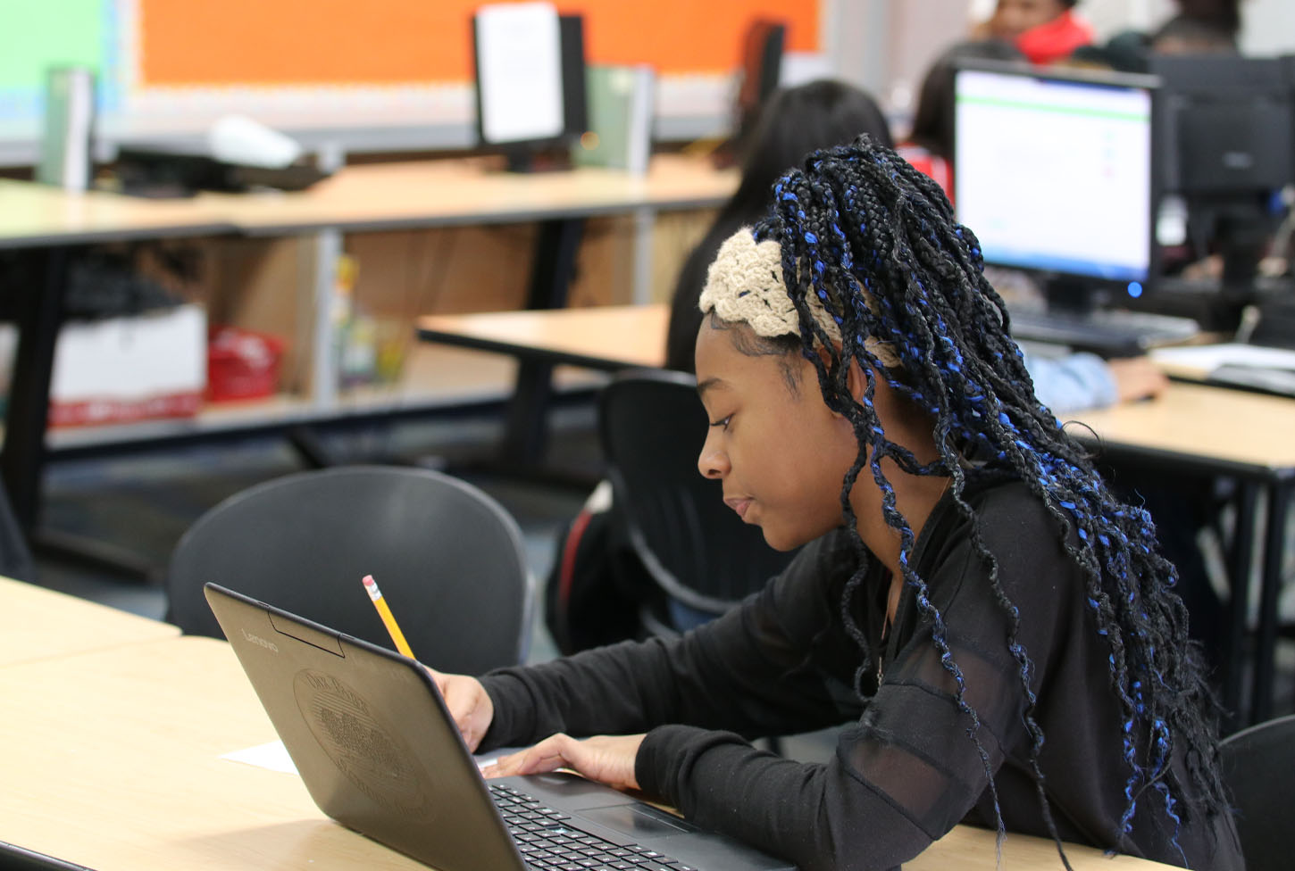 Female student studying using a laptop